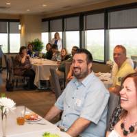 people laughing at tom's speech